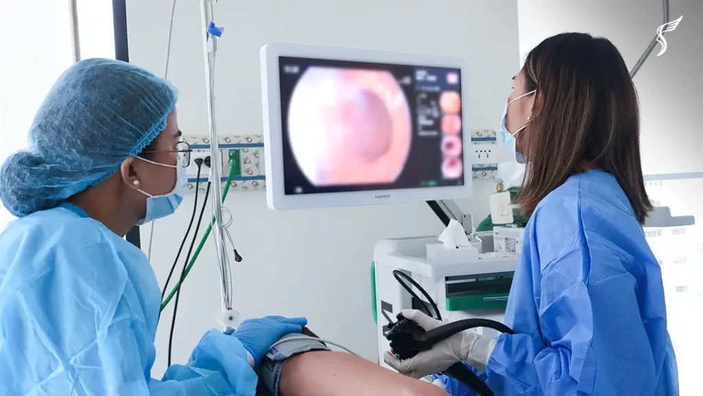 Medical staff perform a colonoscopy procedure while viewing real-time visuals on a monitor at Shinagawa Diagnostic & Preventive Care.