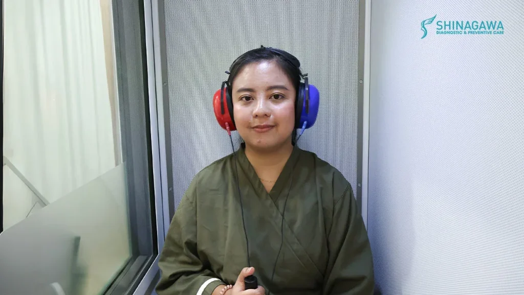 Photo showing patient, Mika Ancheta during her hearing test