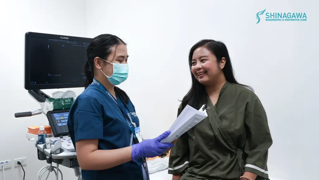 Photo showing patient, Mika Anchet talking with a medical staff during ultrasound
